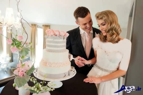 عکس عروس و داماد با کیک عروسی