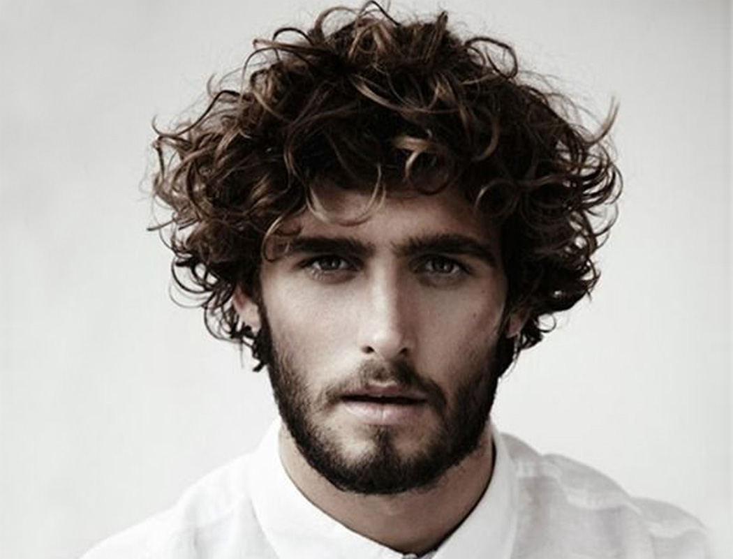 8. "The Best Medium Length Hairstyles for Men with Curly Hair" by Men's Journal - wide 5