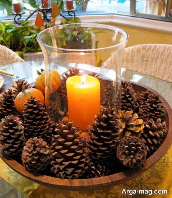 طراحی زیبای شمع با میوه کاج