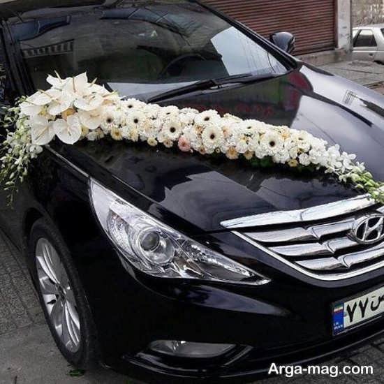 تزیین ماشین عروس مشکی با گل 