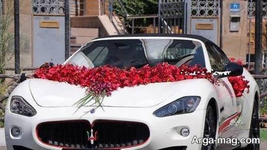 Decorate the white bridal car with red flowers 2021